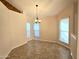 Cozy dining area with tile flooring, a modern chandelier, and natural light from surrounding windows at 1309 W Calle Del Norte --, Chandler, AZ 85224