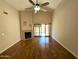 Spacious living room features a fireplace, hardwood floors, high ceilings, and sliding glass doors to the patio at 1309 W Calle Del Norte --, Chandler, AZ 85224
