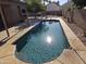 Sparkling swimming pool with surrounding patio, perfect for relaxation and entertaining in a private backyard setting at 1309 W Calle Del Norte --, Chandler, AZ 85224