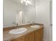 Bathroom with dual sinks, vanity and large mirror at 13217 S Tuthill Rd, Buckeye, AZ 85326