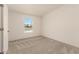 Bedroom featuring neutral carpet and walls with a window at 13217 S Tuthill Rd, Buckeye, AZ 85326