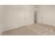 Neutral bedroom showcases carpet, paint, two doors, and electrical outlets at 13217 S Tuthill Rd, Buckeye, AZ 85326