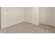 Bedroom featuring neutral carpet and walls with a window at 13217 S Tuthill Rd, Buckeye, AZ 85326