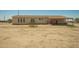 Exterior of house showing covered patio and many windows at 13217 S Tuthill Rd, Buckeye, AZ 85326