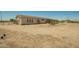 Rear exterior of house showing covered patio and many windows at 13217 S Tuthill Rd, Buckeye, AZ 85326