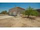 Detached garage with two doors, a side entrance, and space for parking at 13217 S Tuthill Rd, Buckeye, AZ 85326