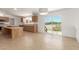 Bright kitchen features wood cabinets, double islands and sliding glass door to the outside patio at 13217 S Tuthill Rd, Buckeye, AZ 85326
