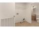 Spacious laundry room with tile floors, shelving, and utility connections at 13217 S Tuthill Rd, Buckeye, AZ 85326