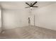 Spacious main bedroom with carpet, ceiling fan, and white walls at 13217 S Tuthill Rd, Buckeye, AZ 85326