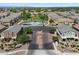 Aerial view of the community with central park, pool and surrounding townhomes at 1350 S Greenfield Rd # 2133, Mesa, AZ 85206