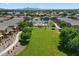 Aerial view of the community showing a pool, common areas and residential buildings at 1350 S Greenfield Rd # 2133, Mesa, AZ 85206