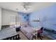 Cozy bedroom with blue accent wall, ceiling fan and two beds at 1350 S Greenfield Rd # 2133, Mesa, AZ 85206