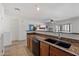 Bright open concept kitchen with granite counters and a view to the living room at 1350 S Greenfield Rd # 2133, Mesa, AZ 85206