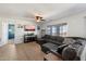 Comfortable living room with a large sectional sofa and bright natural light at 1350 S Greenfield Rd # 2133, Mesa, AZ 85206