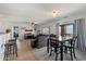 Open-concept living area with neutral tones, tile flooring, and natural light at 1350 S Greenfield Rd # 2133, Mesa, AZ 85206