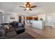 Comfortable living room with open floor plan to dining room and kitchen at 1350 S Greenfield Rd # 2133, Mesa, AZ 85206