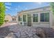 Landscaped backyard with a flagstone patio and desert landscaping at 15936 W Kino Dr, Surprise, AZ 85374