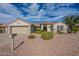 Charming single-story home with desert landscaping and a two-car garage at 15936 W Kino Dr, Surprise, AZ 85374