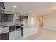 Modern kitchen features granite counters, stainless steel appliances, and tiled backsplash at 15936 W Kino Dr, Surprise, AZ 85374