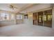 Spacious patio with ceiling fans and sliding glass doors providing access to interior spaces at 15936 W Kino Dr, Surprise, AZ 85374