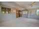 Covered patio with ceiling fans and sliding glass doors at 15936 W Kino Dr, Surprise, AZ 85374