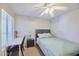 Cozy bedroom with natural light, a ceiling fan, and a desk, perfect for relaxation or study at 16631 E El Lago Blvd # 208, Fountain Hills, AZ 85268