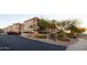 Charming condo community with mature landscaping, a stucco exterior, and a Desert Sage sign at 16631 E El Lago Blvd # 208, Fountain Hills, AZ 85268