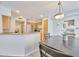 Cozy kitchen with stainless steel appliances and a wooden dining table, perfect for comfortable meals at 16631 E El Lago Blvd # 208, Fountain Hills, AZ 85268