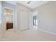 Spacious bedroom with neutral carpet and view to bathroom at 17183 W San Marcos St, Surprise, AZ 85388