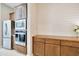 Kitchen with stainless steel appliances, custom cabinets, and a built-in microwave and oven at 17183 W San Marcos St, Surprise, AZ 85388