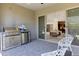 A well-equipped outdoor kitchen with stainless steel grill and mini fridge offers convenient outdoor entertaining at 17183 W San Marcos St, Surprise, AZ 85388
