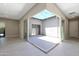 An outdoor patio with a retractable awning and string lights for outdoor entertaining at 17183 W San Marcos St, Surprise, AZ 85388