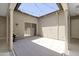 A cozy covered patio with outdoor lighting and access to the interior at 17183 W San Marcos St, Surprise, AZ 85388