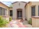 A beautiful walkway leads to the front door of this home, surrounded by lush desert landscaping at 19803 N Desert Song Ct, Surprise, AZ 85374