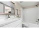 Bathroom featuring a white vanity with a new mirror, white tile and a shower and tub combination at 19820 N 13Th Ave # 175, Phoenix, AZ 85027