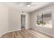 Neutral bedroom with wood floors and a window that offers natural light and an en-suite bathroom at 19820 N 13Th Ave # 175, Phoenix, AZ 85027