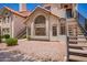 Attractive condo exterior with large windows, terra cotta roof, and low maintenance landscaping at 19820 N 13Th Ave # 175, Phoenix, AZ 85027