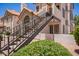 Exterior view of residential condo with private entrance, outdoor stairway, and desert landscaping at 19820 N 13Th Ave # 175, Phoenix, AZ 85027