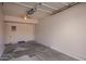 Spacious two-car garage with neutral walls, ceiling fan, and ample space for storage or a workshop area at 19820 N 13Th Ave # 175, Phoenix, AZ 85027