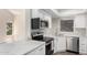 Well-appointed kitchen boasts stainless steel appliances, sleek countertops, and stylish finishes at 19820 N 13Th Ave # 175, Phoenix, AZ 85027