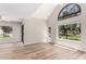 Spacious living room featuring a vaulted ceiling, lots of natural light, and modern finishes at 19820 N 13Th Ave # 175, Phoenix, AZ 85027
