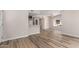 Open-concept living area showcasing modern flooring and abundant natural light through windows at 19820 N 13Th Ave # 175, Phoenix, AZ 85027