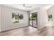 Inviting living room featuring modern flooring, slider door to patio, and an airy ambiance at 19820 N 13Th Ave # 175, Phoenix, AZ 85027