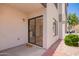 Private patio entrance featuring a 'hello' doormat leading into a modern, light-filled home with sliding glass doors at 19820 N 13Th Ave # 175, Phoenix, AZ 85027