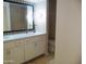 This bathroom features a decorative mirror and dual sinks at 2068 E Cairo Dr, Tempe, AZ 85282