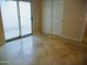 This bedroom has tile floors and a sliding glass door leading outside at 2068 E Cairo Dr, Tempe, AZ 85282