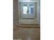 Tile flooring and step up to french doors create an inviting and stylish entrance at 2068 E Cairo Dr, Tempe, AZ 85282