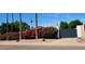 Well-maintained front yard with mature landscaping and privacy gate at 2068 E Cairo Dr, Tempe, AZ 85282