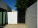 A backyard gate offers privacy and seclusion, enhancing the property's appeal and security at 2068 E Cairo Dr, Tempe, AZ 85282