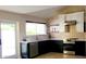 Updated kitchen boasts stainless appliances, white cabinets, quartz counters and eye-catching backsplash at 2068 E Cairo Dr, Tempe, AZ 85282